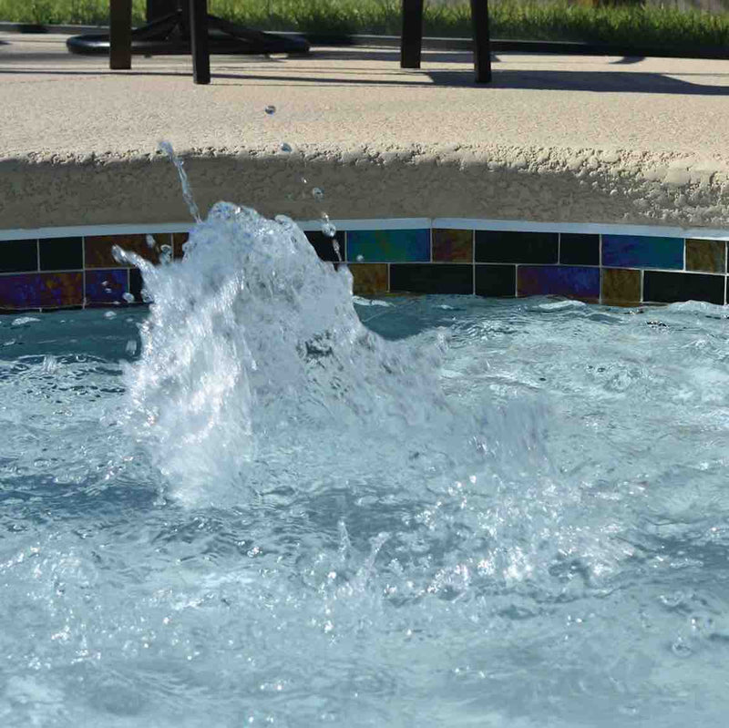 Swimming Pool waterline featuring a black iridescent glass tile by Mineral Tiles