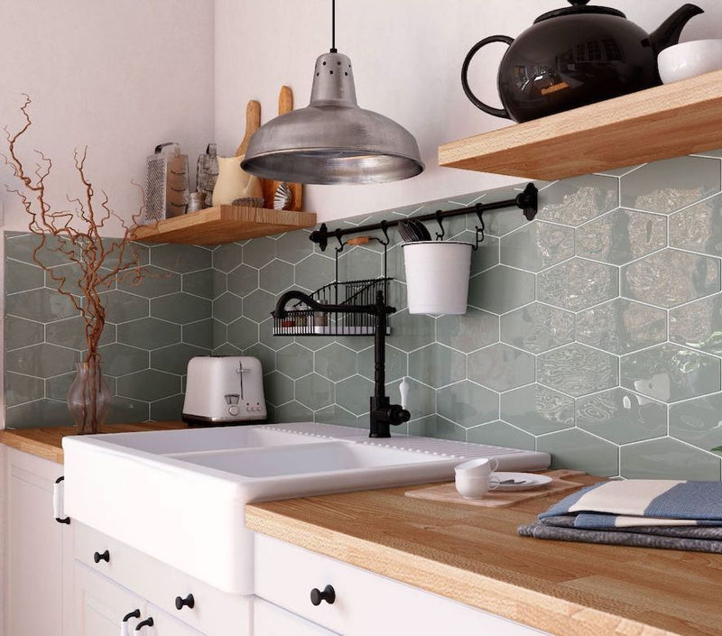 Farmhouse Kitchen backsplash featuring floating shelves and Hexagon Tile Glossy Grey 4x8 Long by Mineral Tiles