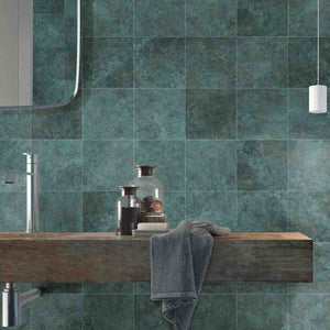 Atol Porcelain Tile Jade 6x6 installed on a bathroom backsplash behind the vanity