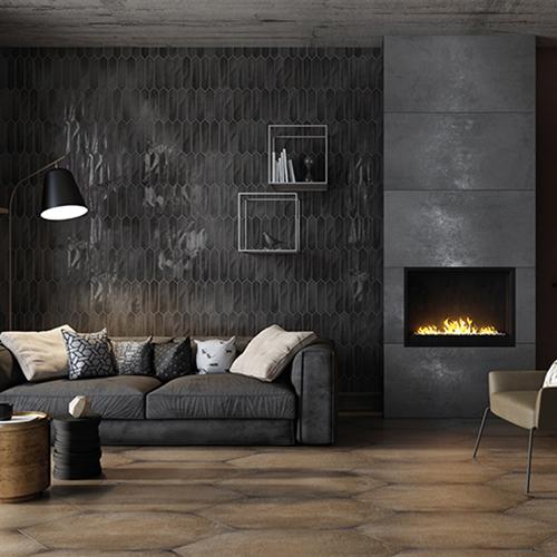 Charcoal Glossy 3x12 Picket Ceramic Wall Tile featured on a living room wall and fireplace
