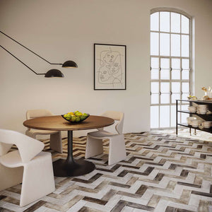 Herringbone pattern tile by mineral tiles installed on a modern dining room