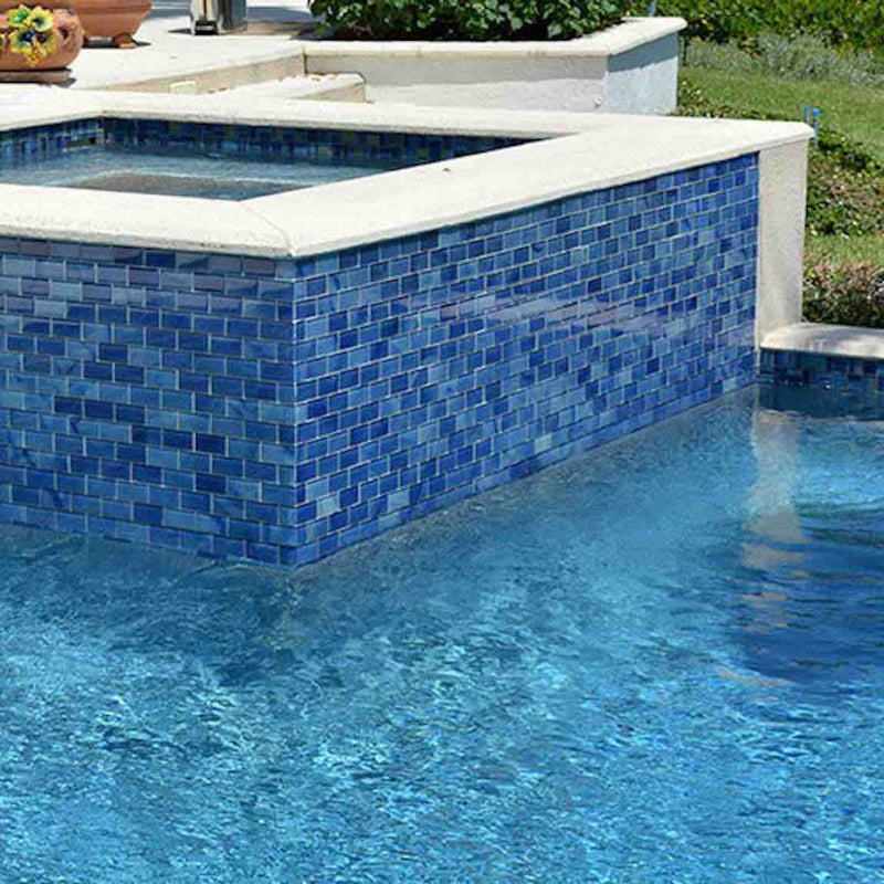 Pool spa featuring a blue subway glass tile by Mineral Tiles
