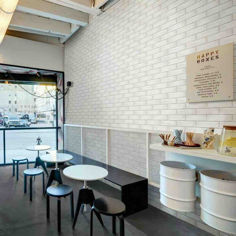 Brick Porcelain Tile Pure 3x11 installed on a restaurant featured wall