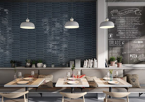 Restaurant wall featuring Urban Navy Glossy 3x12 Picket Ceramic Wall Tile by Mineral Tiles 