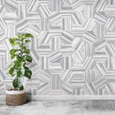 Studio Hexagon Swirl Grey Porcelain Tile 9x10 installed on a featured wall