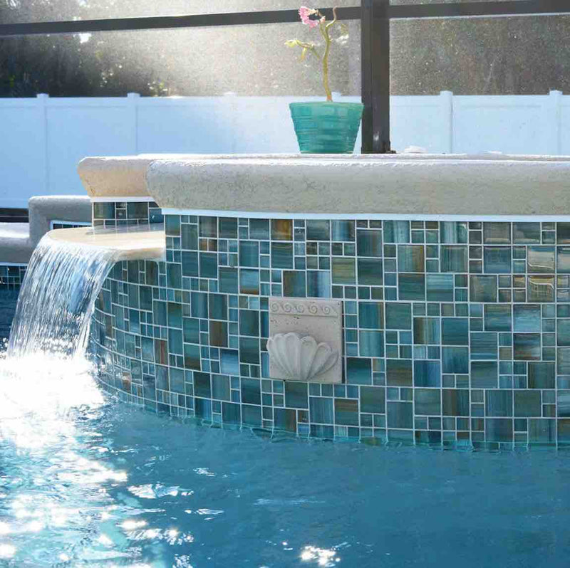 Turquoise Glass Mosaic Tile Multi Pattern installed on a pool waferfall