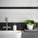 Bathroom Backsplash featuring a mis of white and black subway tiles 3x6 beveled and glossy finish