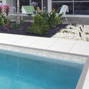 White Deck and Waterline Tiles installed on a Swimming Pool